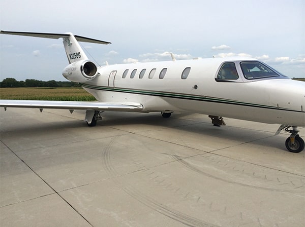 a lear jet parked on runway