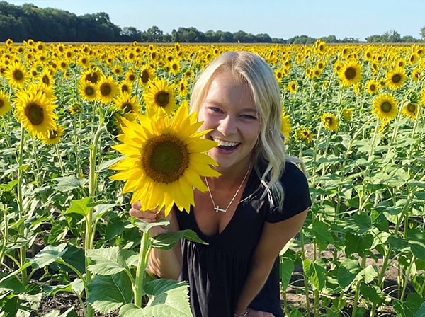 girl in sea of sunflowers 